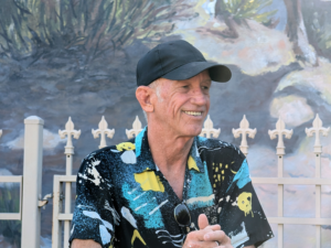 Photo of Thom Guerra the sign painter at the Olaf Wieghosrt Museum 